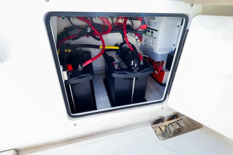 Slide: The Image of Battery compartment of a 2015 Southport 33 FE boat, showing wiring and connections. - 35