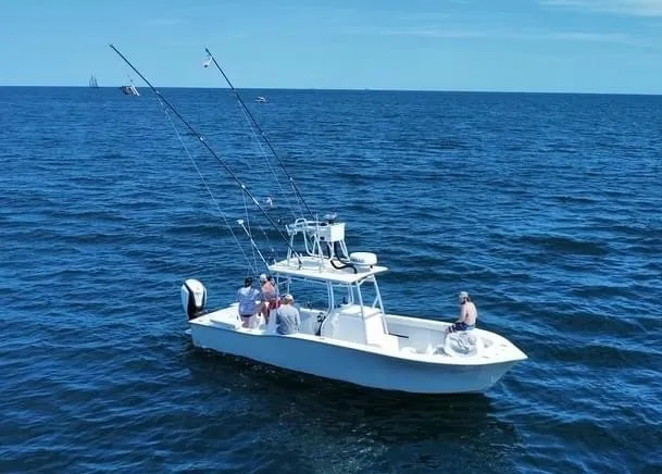 Slide: The Image of A 2017 Valentino 28 boat on open water with anglers on board. - 1