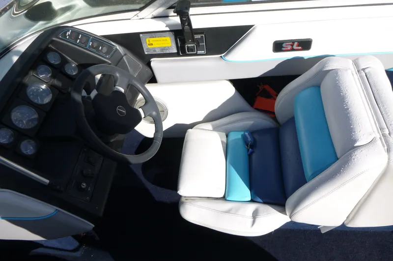 Slide: The Image of 1992 Chaparral boat cockpit with steering wheel and cushioned seat. - 7