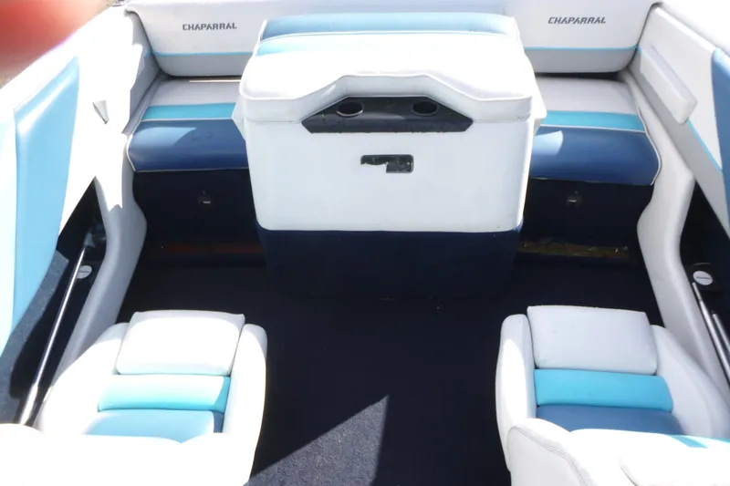 Slide: The Image of Interior of a 1992 Chaparral boat with blue and white seating. - 10
