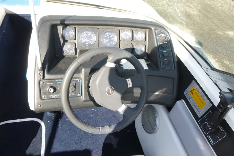 Slide: The Image of 1992 Chaparral boat dashboard with steering wheel and instrument panel. - 8