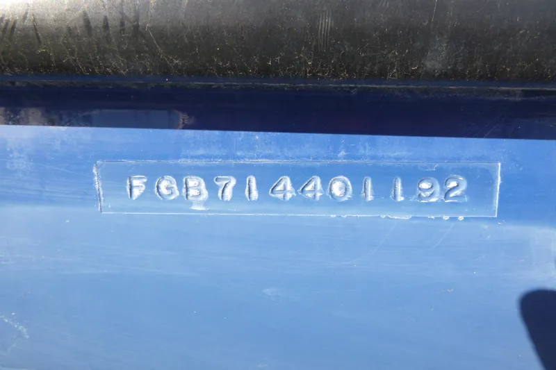 Slide: The Image of Hull identification number on a 1992 Chaparral boat, embossed on a blue surface. - 13