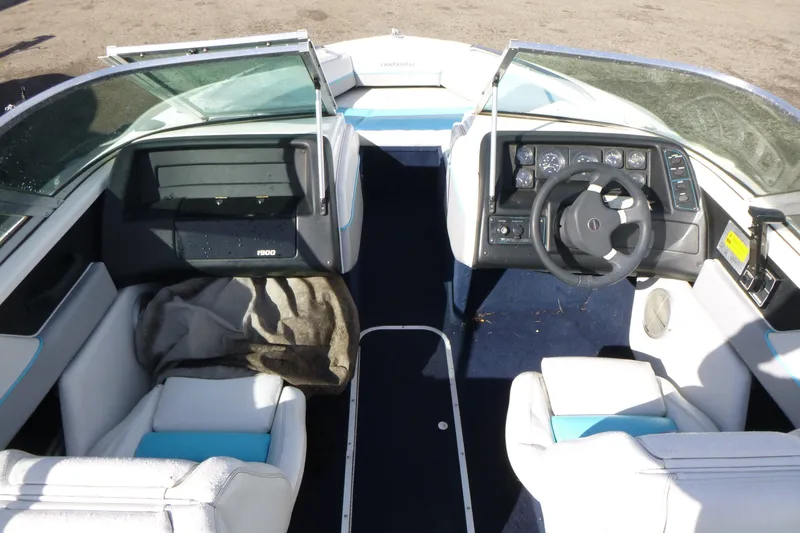 Slide: The Image of 1992 Chaparral boat interior with steering wheel, dashboard, and seating. - 5