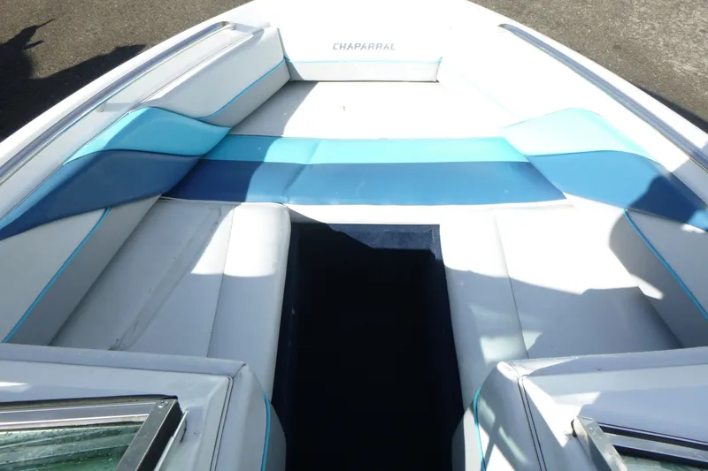 Slide: The Image of 1992 Chaparral boat interior with blue and white seating, showcasing sleek design and comfort. - 6