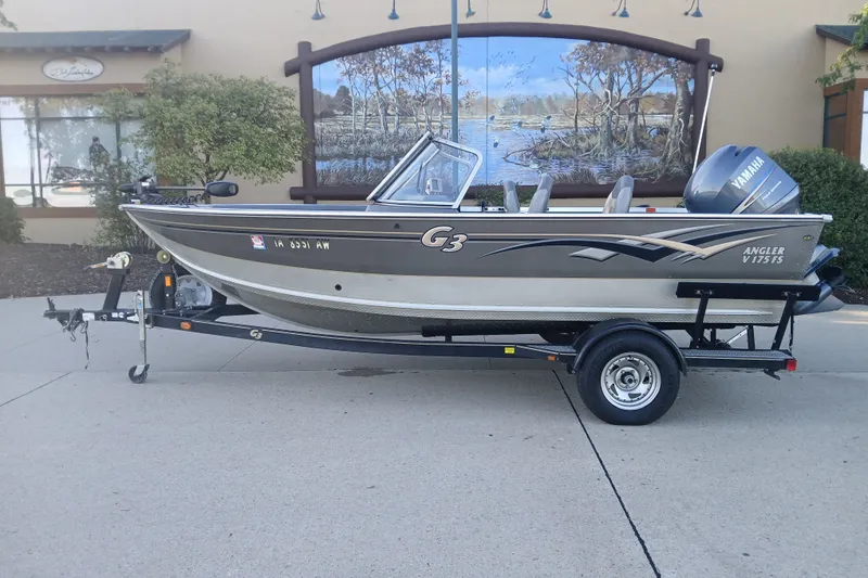 Slide: The Image of 2005 G3 Angler V175 FS boat on trailer, parked outdoors. - 1
