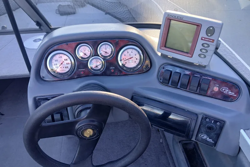 Slide: The Image of Dashboard of a 2005 G3 Angler V175 FS boat with gauges and Eagle fish finder. - 11