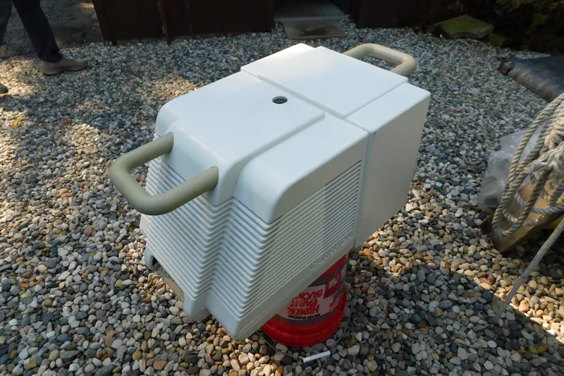 Slide: The Image of White marine air conditioning unit on gravel, suitable for 1996 Sea Ray 250 Sundancer. - 92