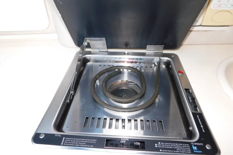 Slide: The Image of Stove in 1996 Sea Ray 250 Sundancer boat galley, featuring a single burner. - 58
