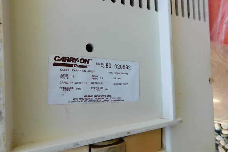Slide: The Image of Label on Carry-On Cruisair 4200P air conditioner, showing specifications and serial number. - 94