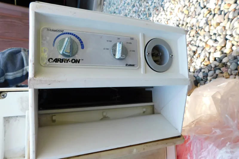 Slide: The Image of Close-up of a Carry-On thermostat control panel on a 1996 Sea Ray 250 Sundancer boat. - 95