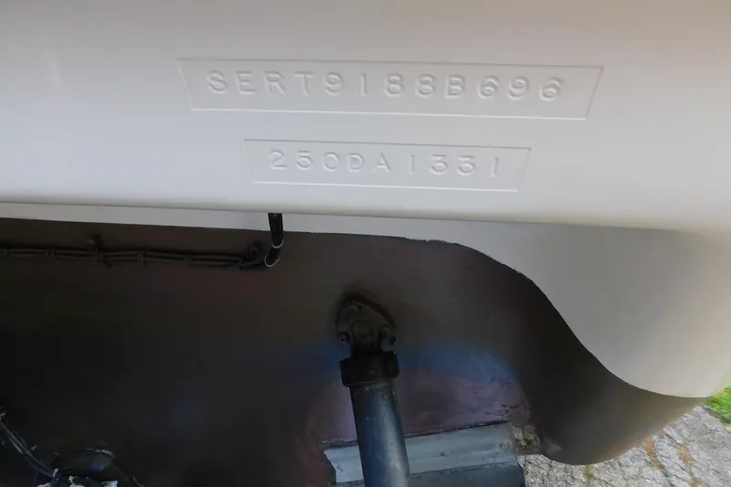 Slide: The Image of 1996 Sea Ray 250 Sundancer hull identification number and stern view. - 9