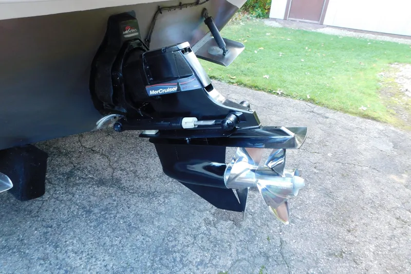 Slide: The Image of 1996 Sea Ray 250 Sundancer with MerCruiser outdrive, parked on concrete driveway. - 10