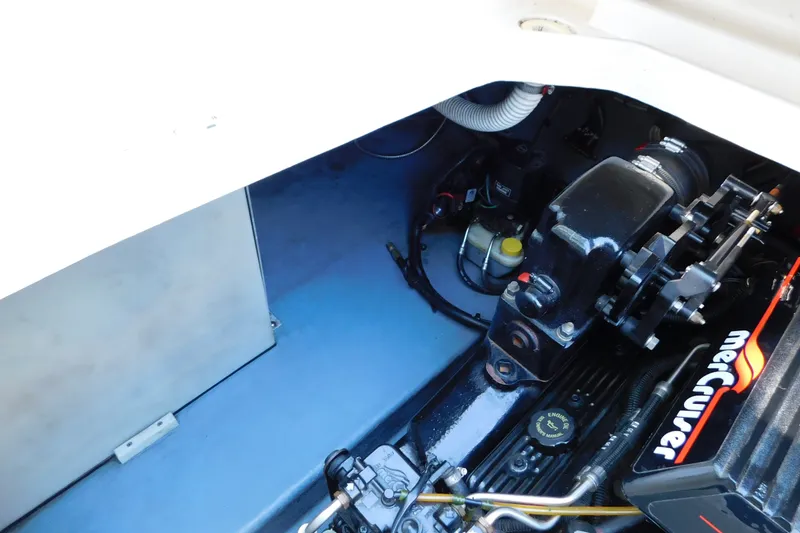Slide: The Image of Engine compartment of a 1996 Sea Ray 250 Sundancer with MerCruiser components. - 82