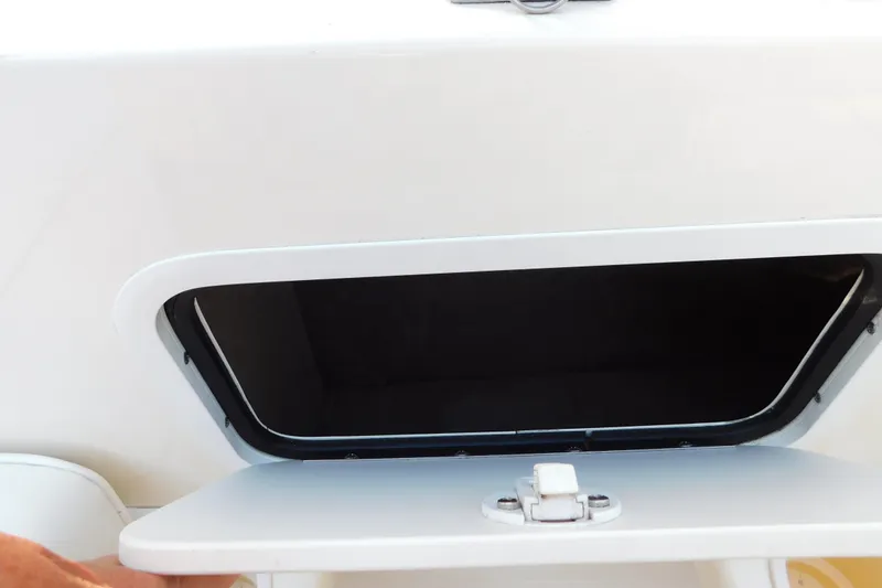 Slide: The Image of Open storage compartment on a 1996 Sea Ray 250 Sundancer boat. - 39