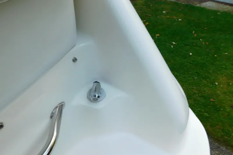 Slide: The Image of Close-up of a 1996 Sea Ray 250 Sundancer boat's chrome handle and fitting. - 24