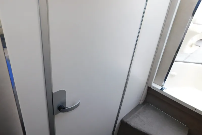 Slide: The Image of Interior cabin door of a 1996 Sea Ray 250 Sundancer boat. - 68