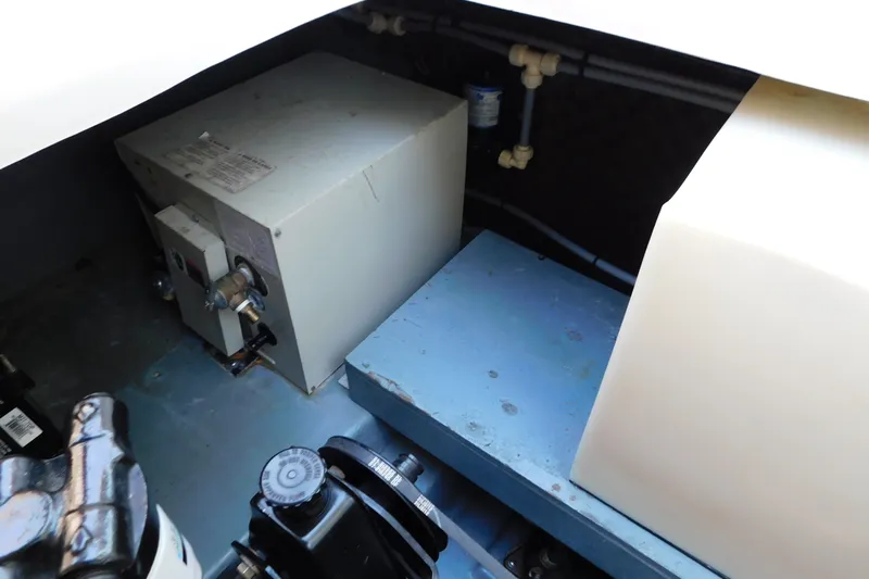 Slide: The Image of Engine compartment of a 1996 Sea Ray 250 Sundancer boat, showing mechanical components. - 87