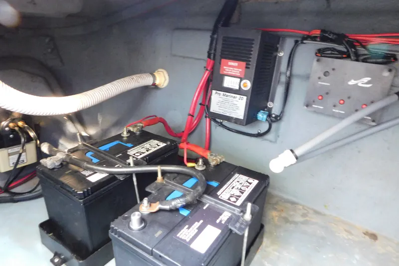 Slide: The Image of Electrical system of a 1996 Sea Ray 250 Sundancer with batteries and wiring. - 85