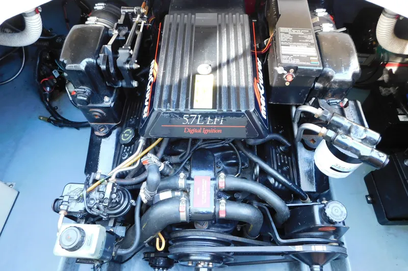 Slide: The Image of Engine compartment of a 1996 Sea Ray 250 Sundancer with 5.7L EFI digital ignition. - 81