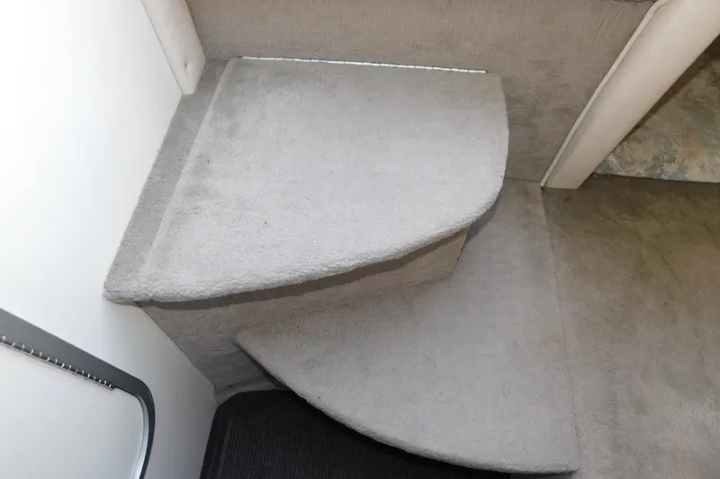 Slide: The Image of Carpeted steps inside a 1996 Sea Ray 250 Sundancer boat cabin. - 65