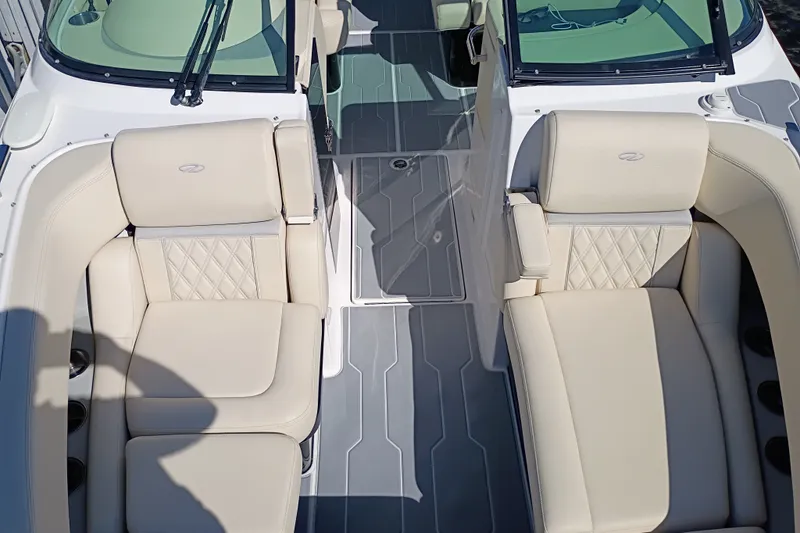 Slide: The Image of 2021 Regal 29 OBX boat interior with beige leather seating and modern design. - 22