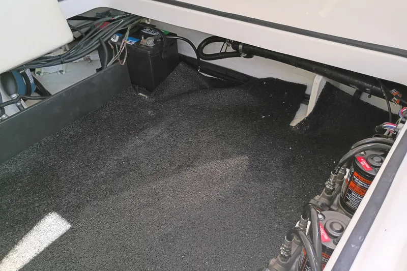 Slide: The Image of 2021 Regal 29 OBX boat interior showing battery compartment and wiring setup. - 31