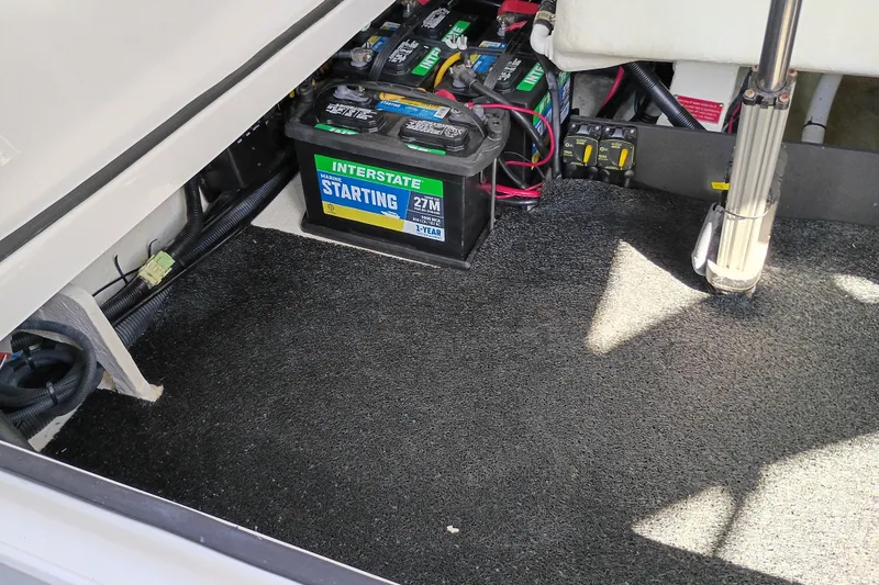 Slide: The Image of Battery compartment of a 2021 Regal 29 OBX boat with Interstate marine batteries. - 30