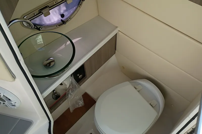Slide: The Image of 2021 Regal 29 OBX boat bathroom with modern sink and toilet. - 46