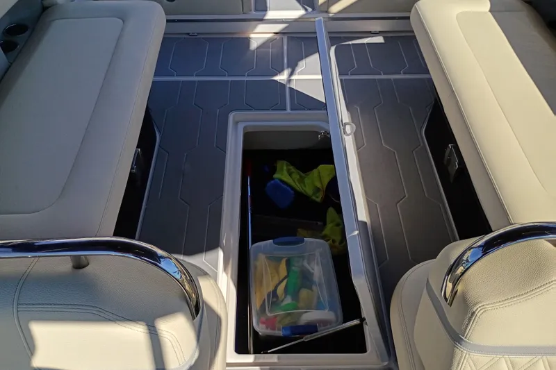Slide: The Image of Interior storage compartment of 2021 Regal 29 OBX boat with seating and accessories. - 28
