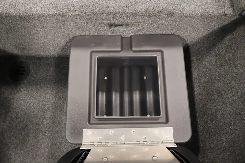 Slide: The Image of 2024 Tracker Bass Tracker Classic XL storage compartment, open and empty, with carpeted interior. - 32