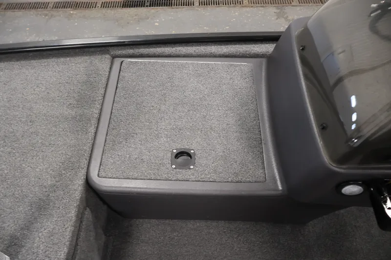Slide: The Image of 2024 Tracker Bass Tracker Classic XL boat interior with carpeted storage compartment. - 17