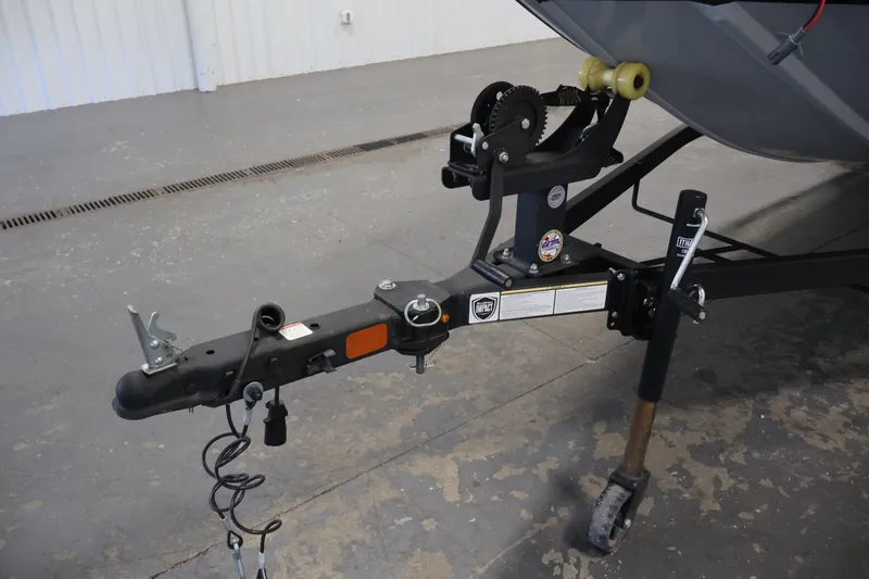 Slide: The Image of Trailer hitch of 2024 Tracker Bass Tracker Classic XL boat in a garage setting. - 45