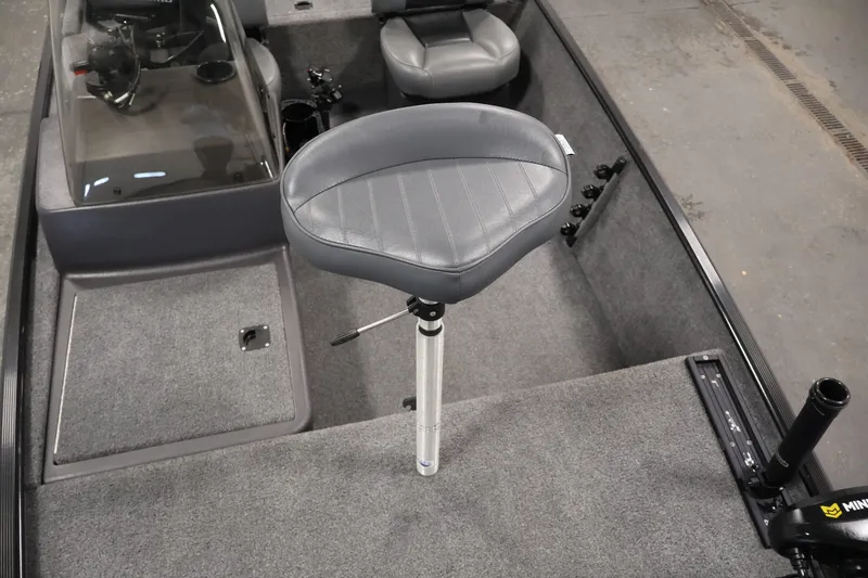 Slide: The Image of 2024 Tracker Bass Tracker Classic XL boat interior with swivel seat and steering console. - 15