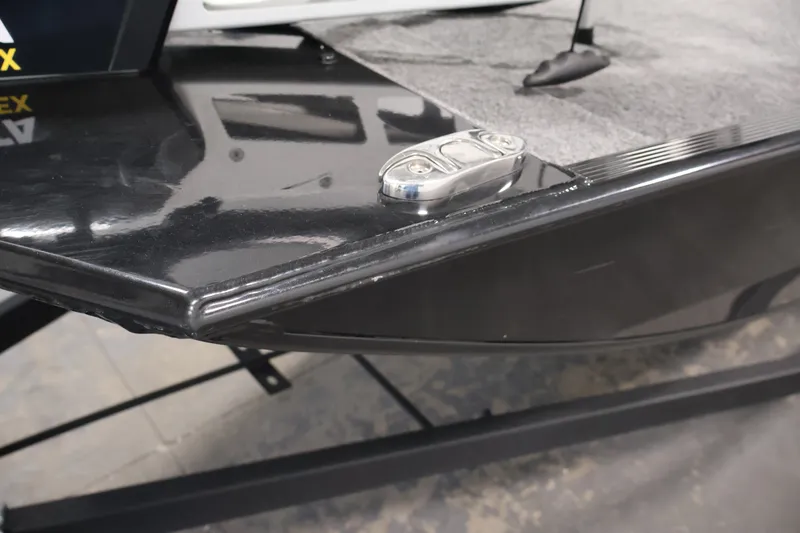 Slide: The Image of 2024 Tracker Bass Tracker Classic XL boat bow with sleek black finish and metal cleat. - 48