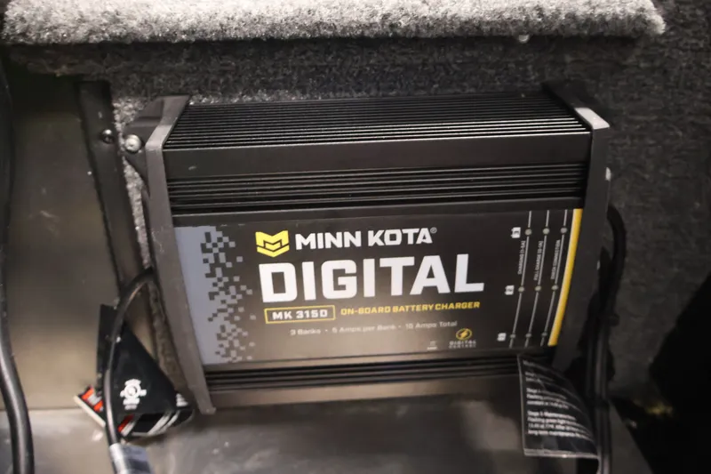Slide: The Image of Minn Kota digital onboard battery charger in 2024 Tracker Bass Tracker Classic XL boat. - 38