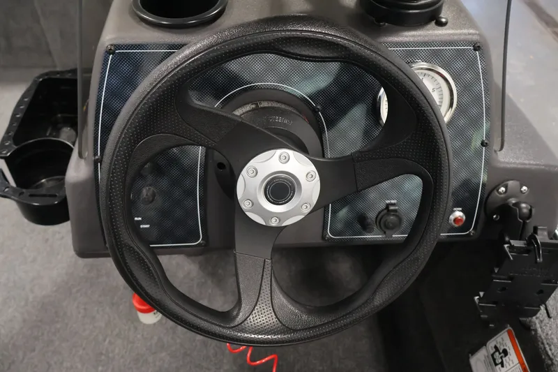 Slide: The Image of 2024 Tracker Bass Tracker Classic XL steering wheel and dashboard close-up. - 23
