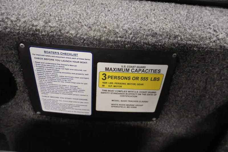 Slide: The Image of 2024 Tracker Bass Tracker Classic XL capacity label, 3 persons or 555 lbs, safety checklist. - 28
