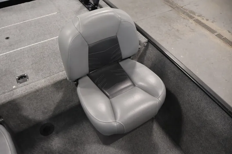 Slide: The Image of 2024 Tracker Bass Tracker Classic XL boat seat, gray upholstery, indoor setting. - 31