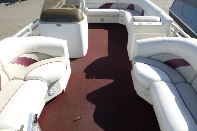 Slide: The Image of Interior of a 2004 J 21' Neptune boat with white and maroon seating. - 3