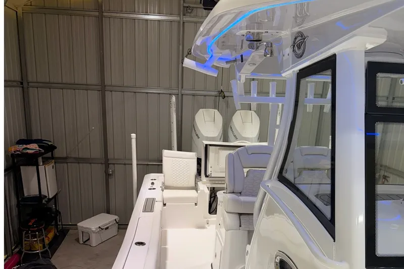 Slide: The Image of 2027 Tidewater 3100 Carolina Bay boat in a storage facility, showcasing sleek design and modern features. - 10