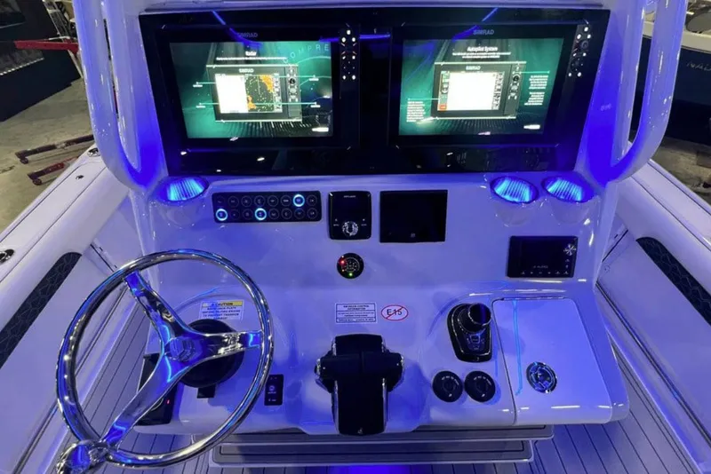 Slide: The Image of Manufacturer Provided Image: Tidewater 3100 Carolina Bay 2027 helm with modern displays. - 13
