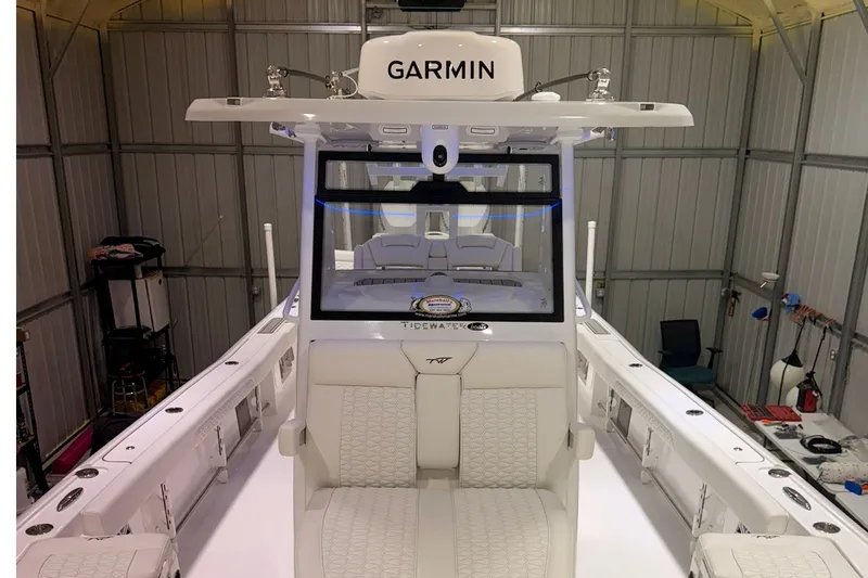Slide: The Image of 2027 Tidewater 3100 Carolina Bay boat with Garmin equipment in a storage facility. - 9