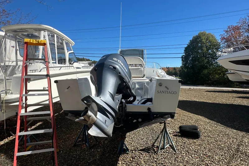 Slide: The Image of 1978 Mako 252 Center Console boat with Yamaha outboard motor on gravel lot. - 3