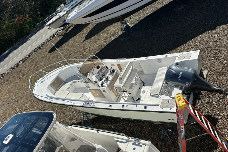 Slide: The Image of 1978 Mako 252 Center Console boat with outboard motor on display. - 4