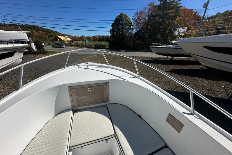 Slide: The Image of 1978 Mako 252 Center Console boat for sale, parked outdoors on a sunny day. - 8