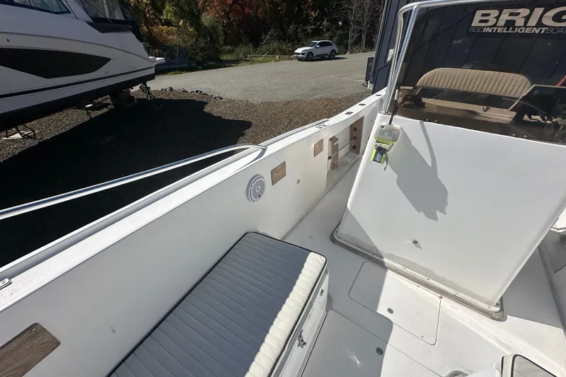 Slide: The Image of 1978 Mako 252 Center Console boat interior with seating and console details. - 14