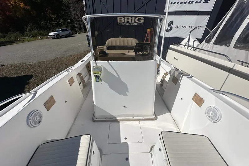 Slide: The Image of 1978 Mako 252 Center Console boat interior with seating and steering console. - 7