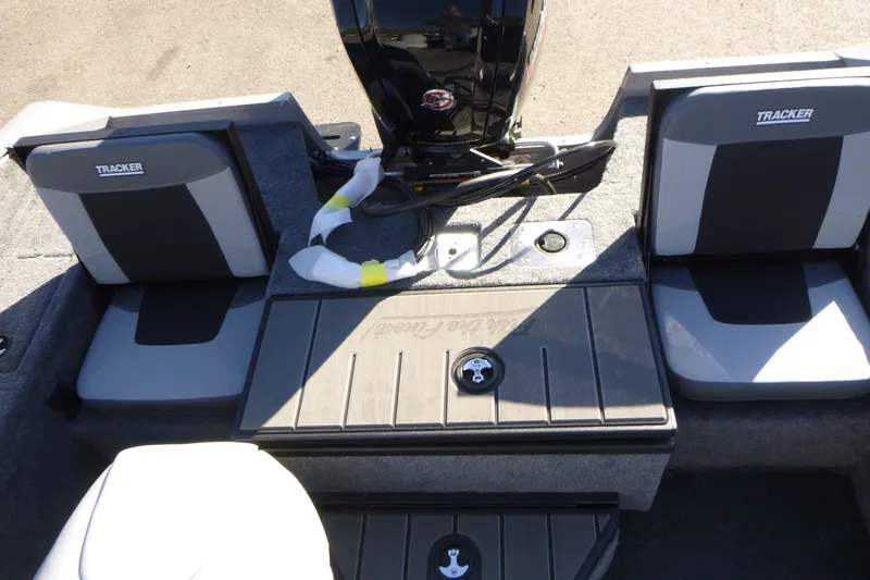 Slide: The Image of 2027 Tracker Pro Guide V-175 Combo boat interior with seating and motor. - 13