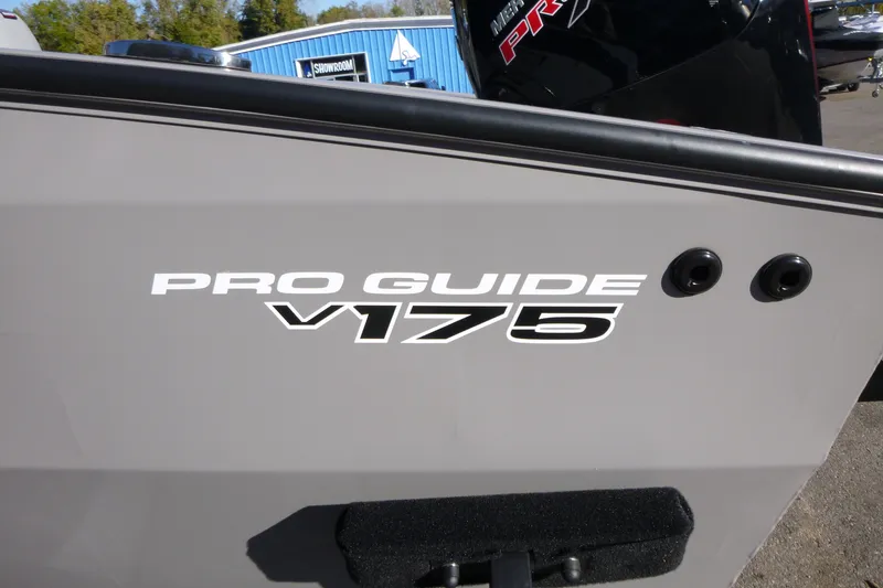 Slide: The Image of 2027 Tracker Pro Guide V-175 Combo boat side view with logo. - 15
