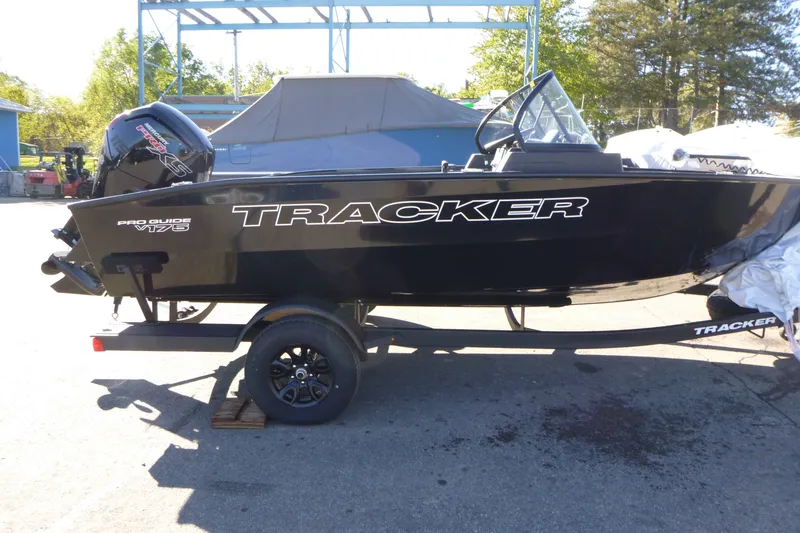 The Image of 2027 Tracker Pro Guide V-175 WT boat on trailer, parked outdoors. - 0